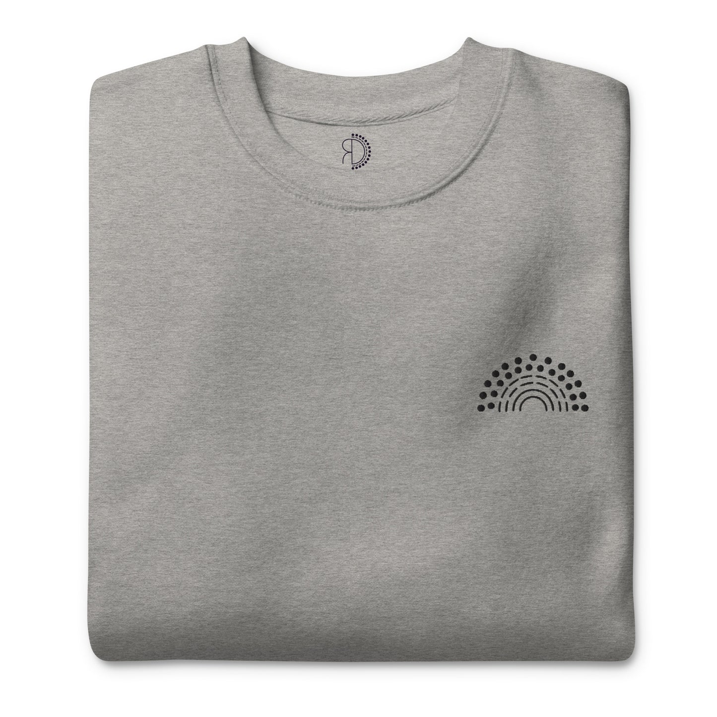 folded grey crewneck sweatshirt with black pride rainbow embroidered on the left chest