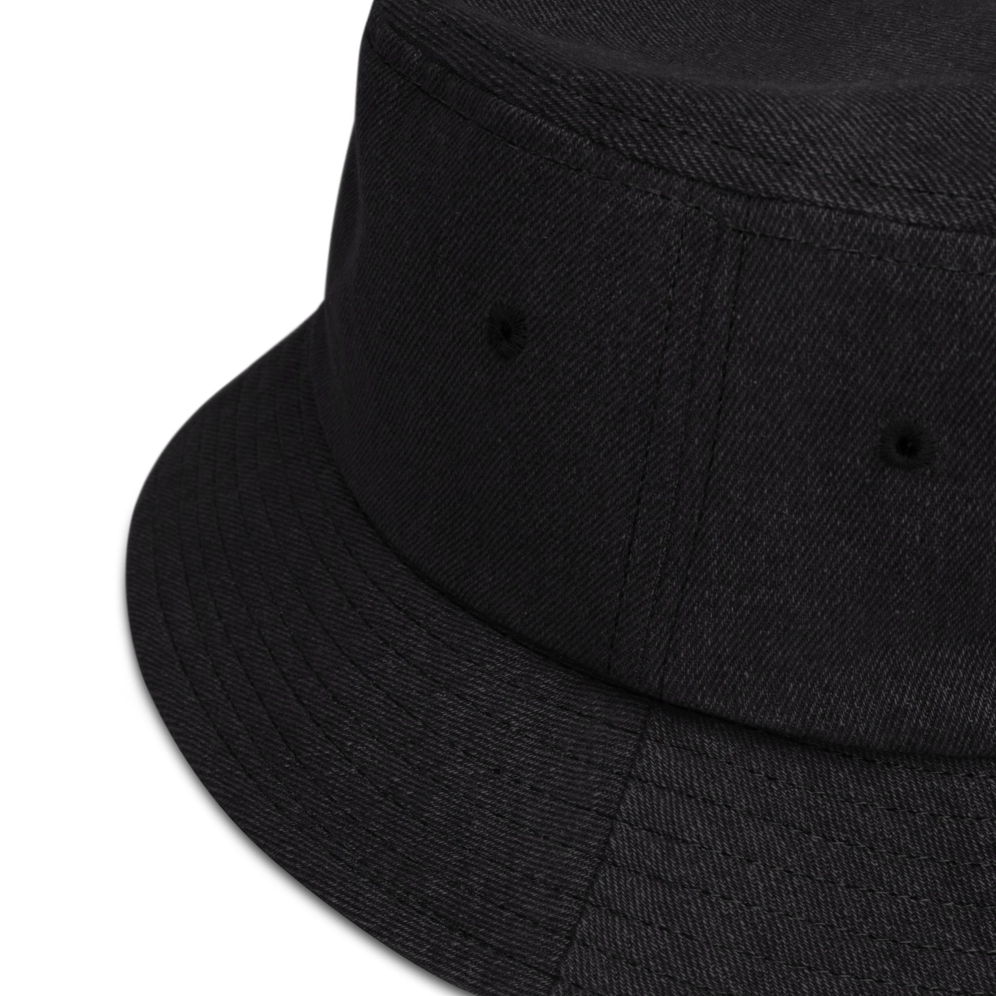 zoomed in image of black denim bucket hat showing detail of fabric