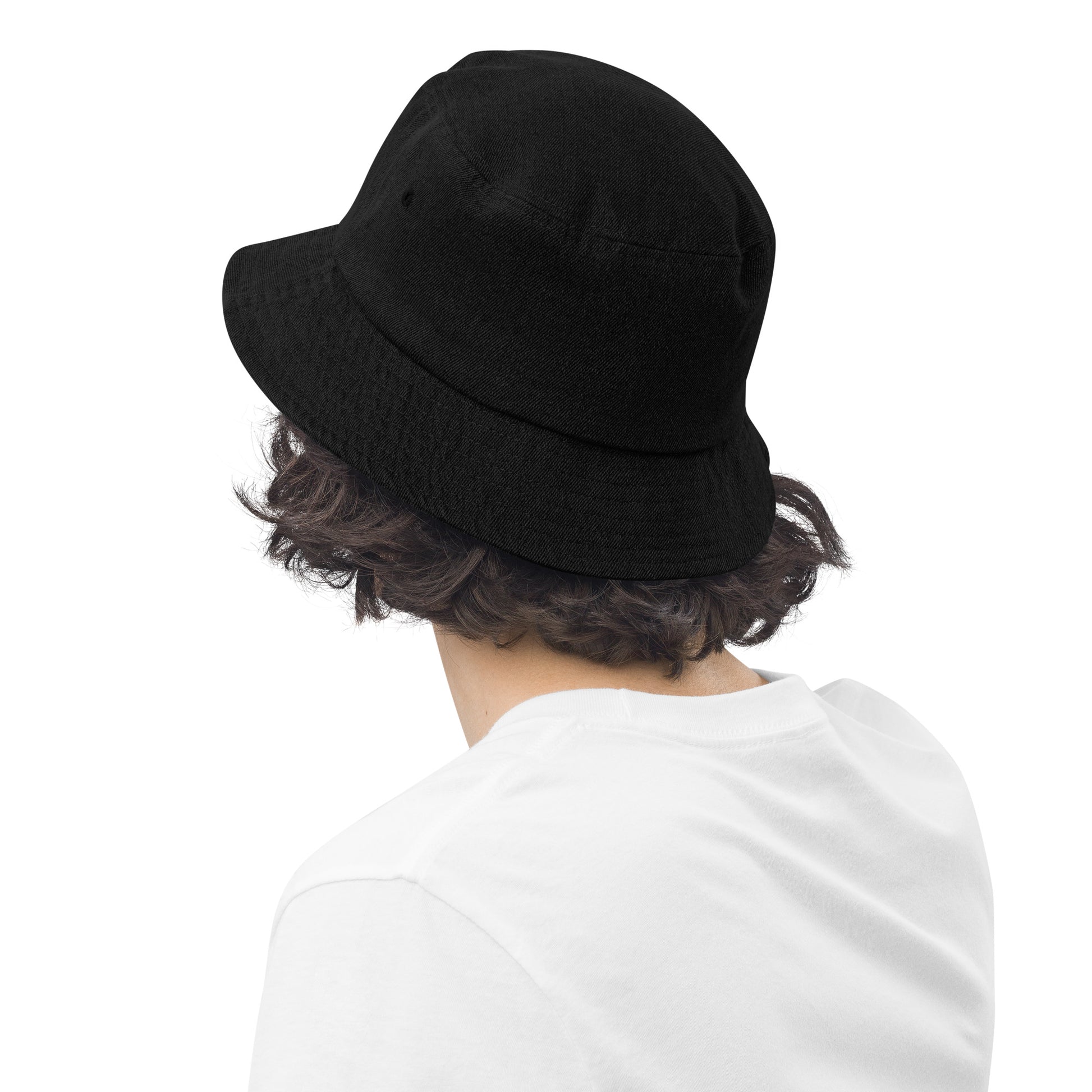 person wearing a black denim bucket hat displaying the back of the hat