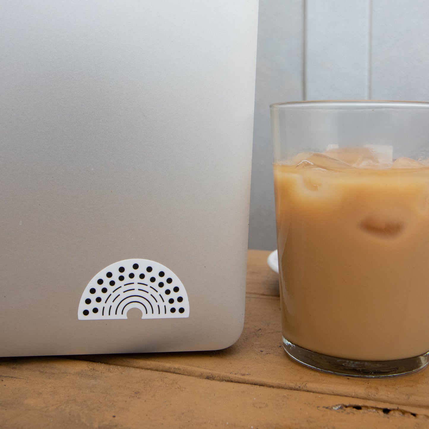 Zoomed in image of a laptop with a black pride sticker