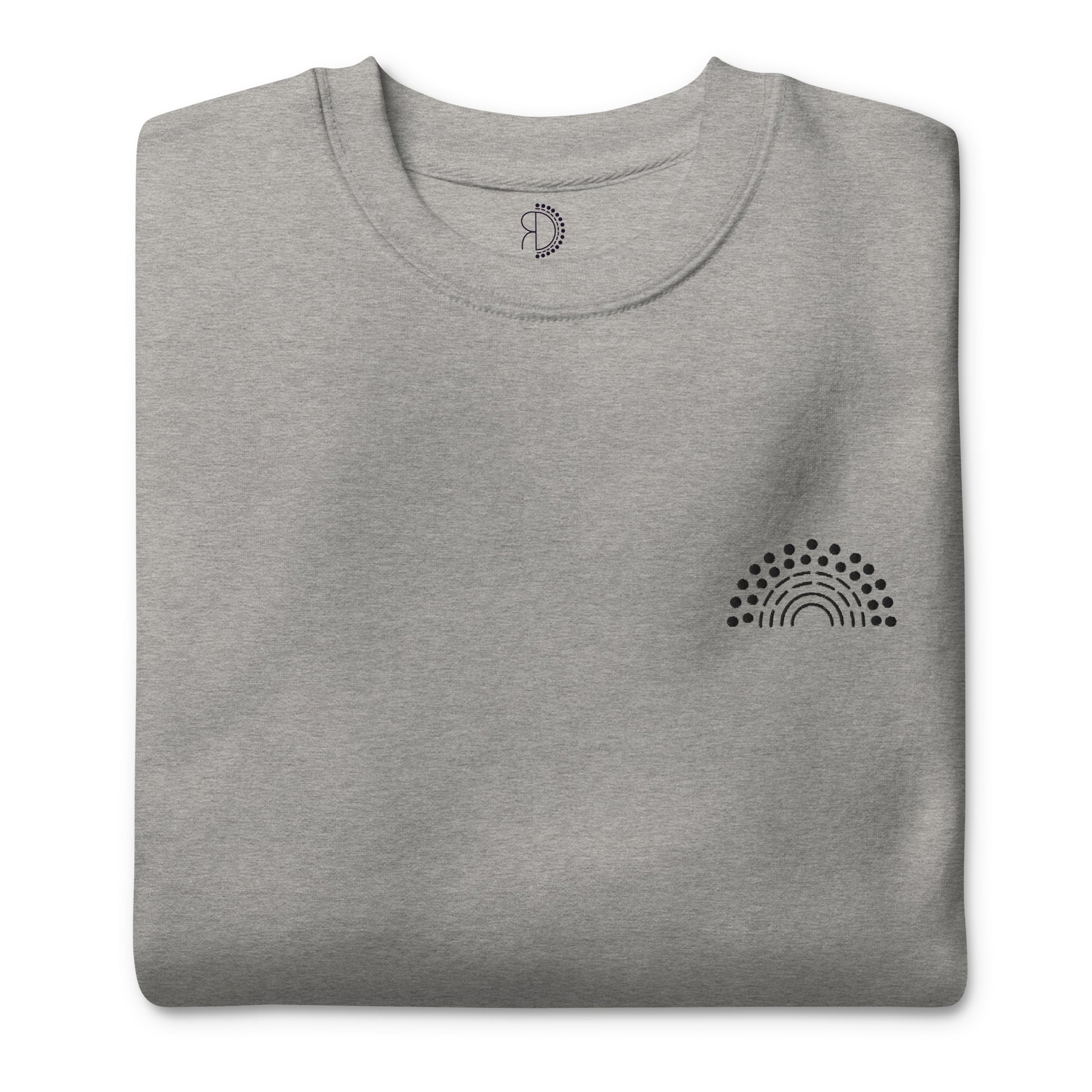 folded grey crewneck sweatshirt with black pride rainbow embroidered on the left chest 