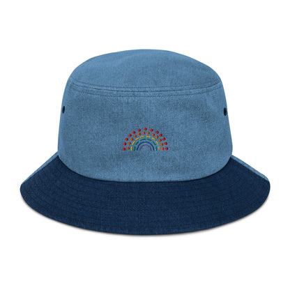 mixed denim bucket hat with multicolored pride rainbow embroidered on center of the hat