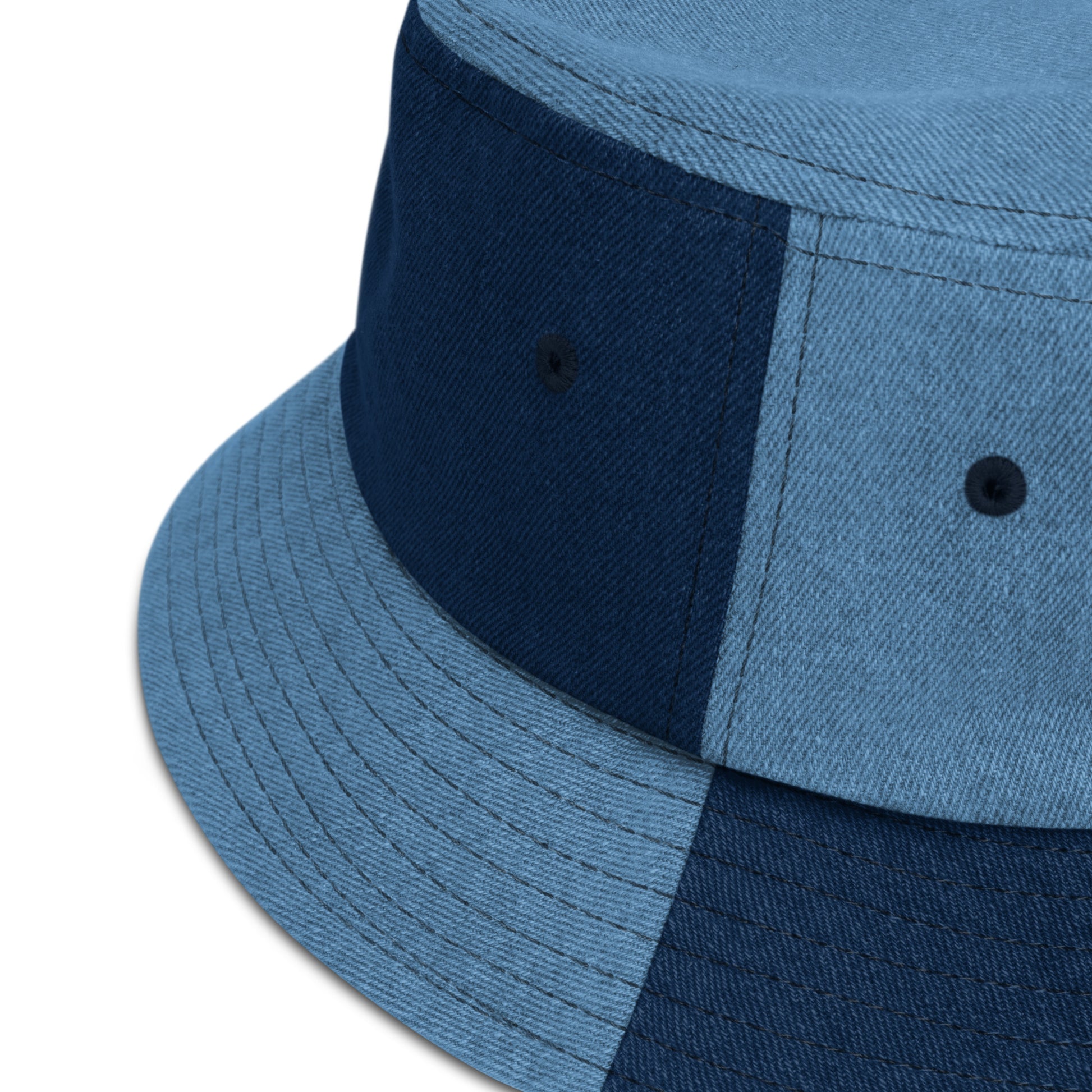 zoomed in image of mixed denim bucket hat showing detail of fabric