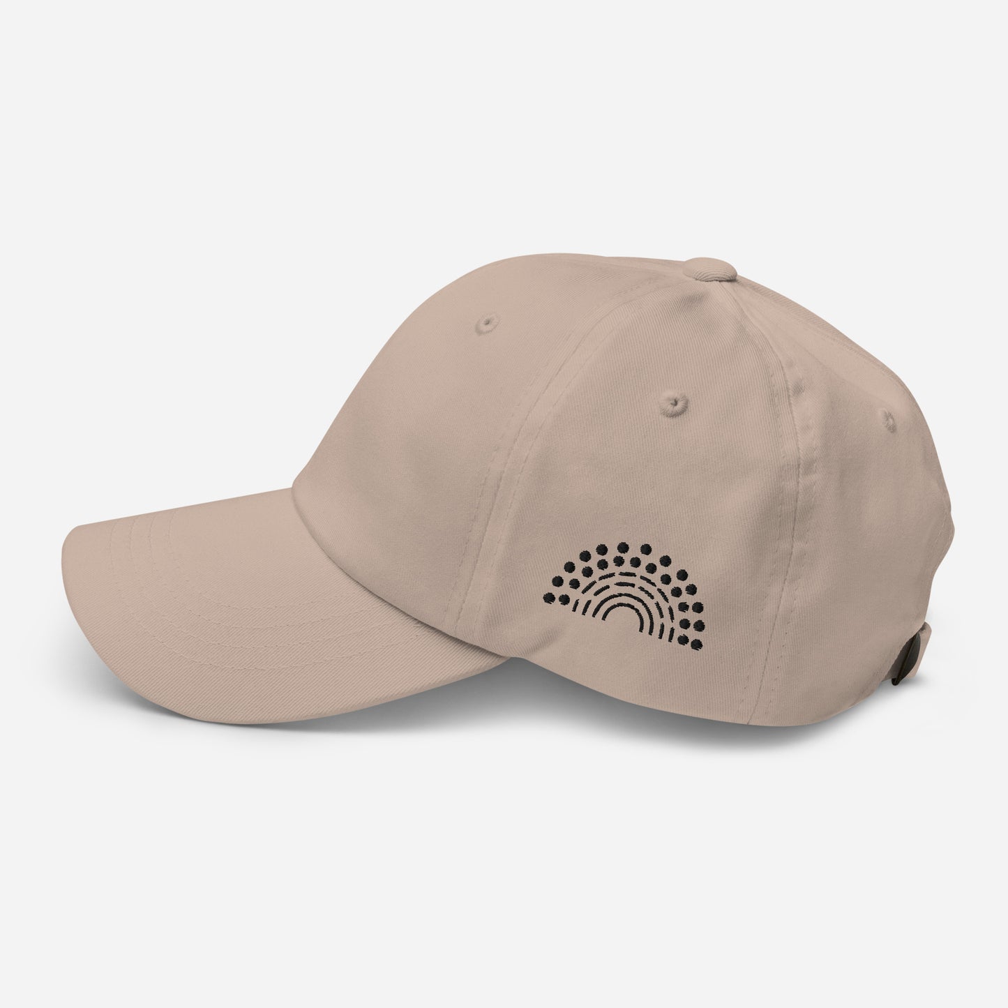 stone tan baseball dad hat with black pride rainbow embroidered on the left of the hat