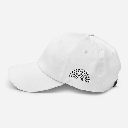 white baseball dad hat with black pride rainbow embroidered on the left of the hat