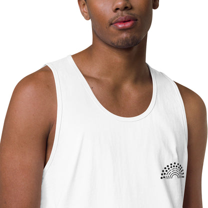 zoomed in image of person wearing a white athletic tank top with black pride rainbow embroidered on the left chest