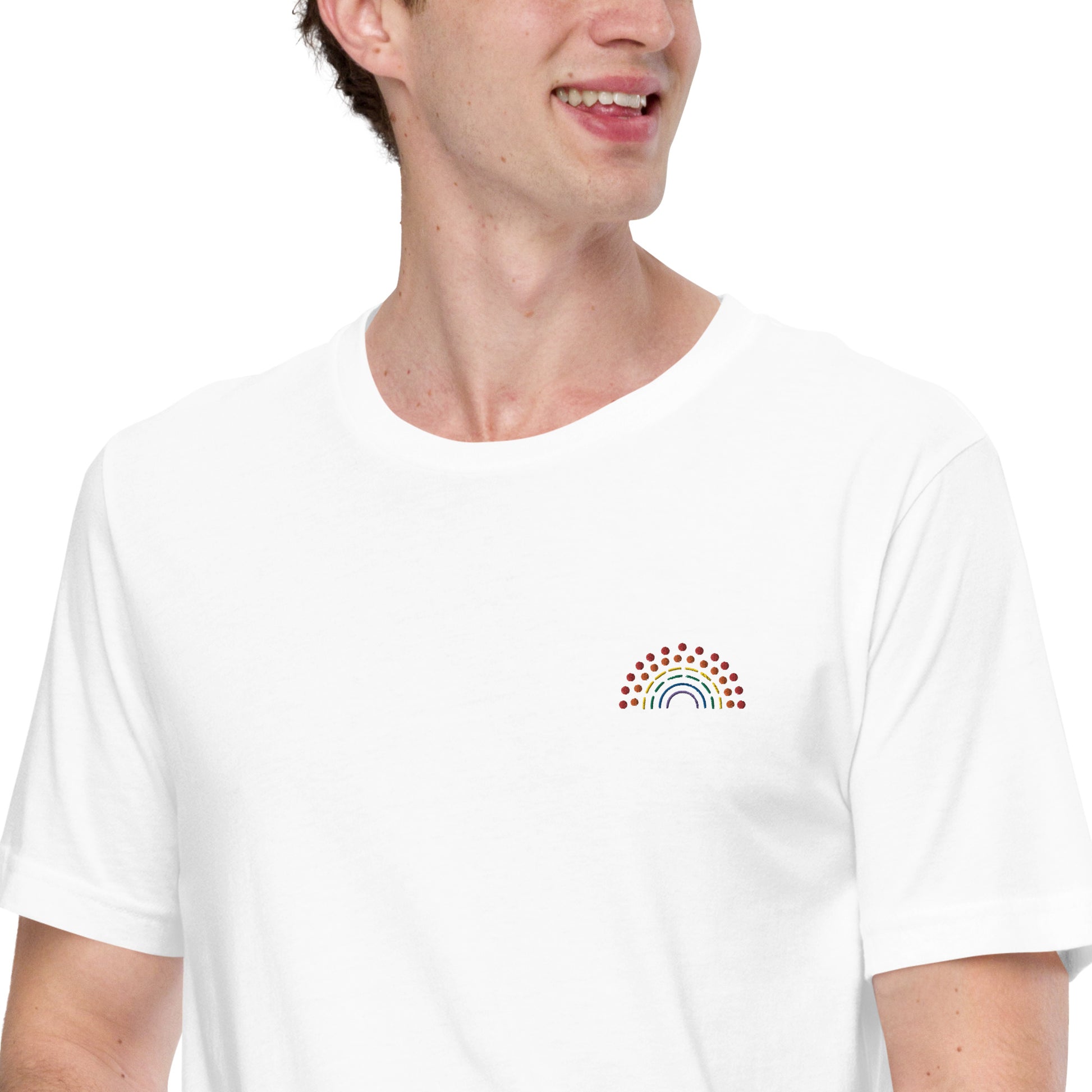 person wearing a white t-shirt with multicolored pride rainbow embroidered on the left chest