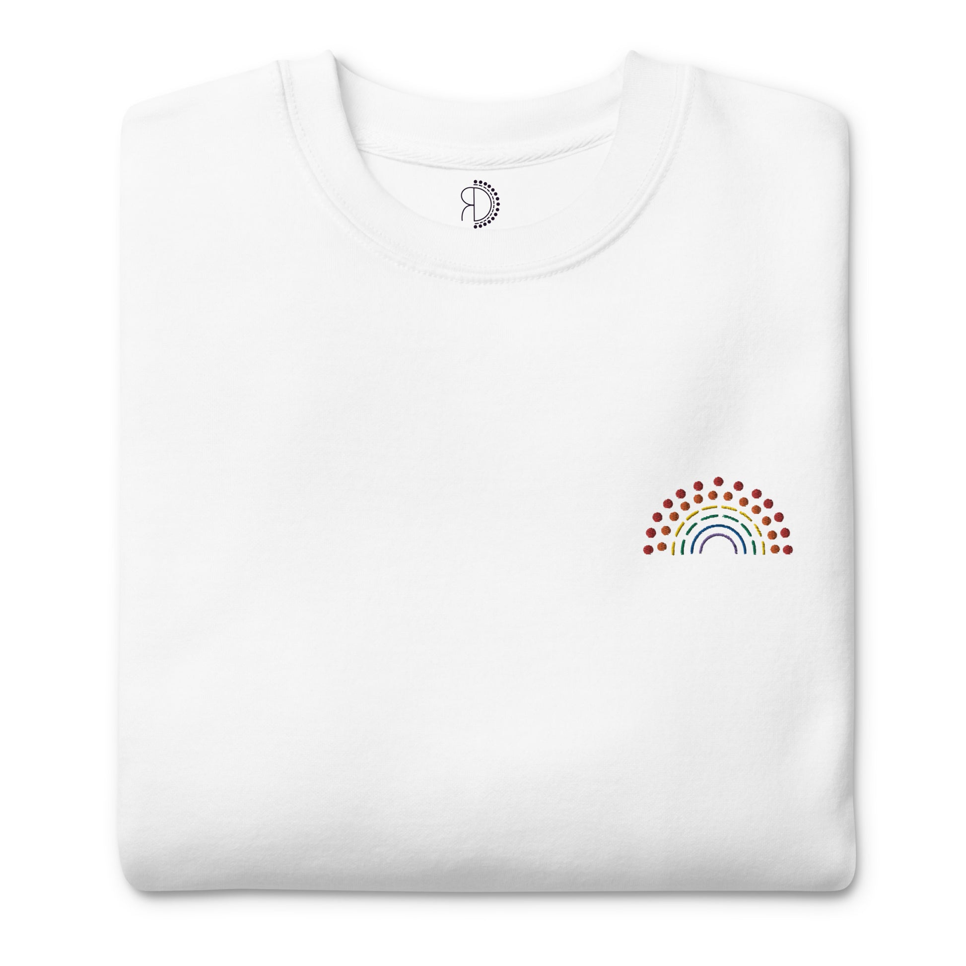 folded white crewneck sweatshirt with multicolored pride rainbow embroidered on the left chest and an inside label featuring logo